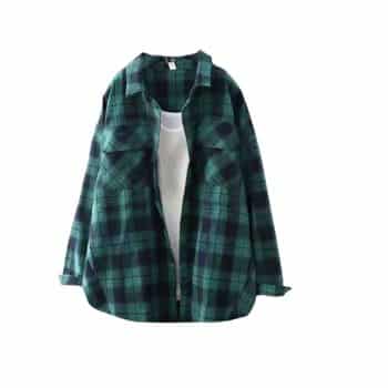 Green and black plaid flannel shirt worn over a plain white t-shirt, displayed against a white background.