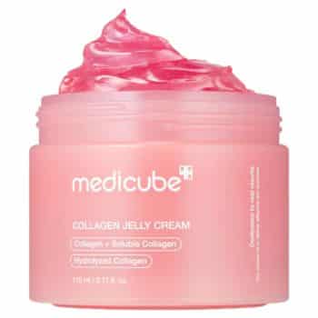 A pink jar of Medicube Collagen Jelly Cream with a swirl of bright pink jelly cream visible above the open container. Product labels highlight collagen ingredients and a 110 ml size.