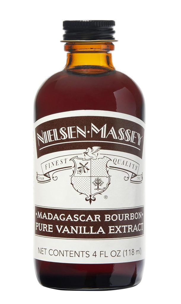 A brown glass bottle labeled “Nielsen-Massey Madagascar Bourbon Pure Vanilla Extract,” 4 fluid ounces (118 ml), with a black cap and vintage-style label—perfect for adding rich flavor to your cookie stamp shortbread recipes.
