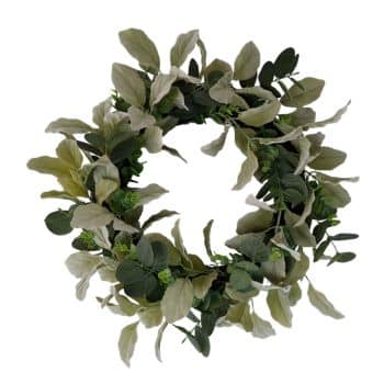 A circular wreath made of green eucalyptus leaves and other light green foliage, arranged densely to form a ring shape on a white background.