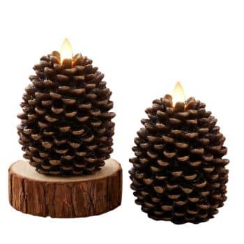 Brown pinecone flameless candles with warm flickering LED lights styled with fall pumpkins and autumn decor.