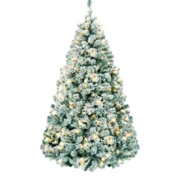 A full, snow-frosted artificial Christmas tree with warm white lights glowing throughout its branches, displayed on a white background.