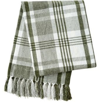 Green and white plaid chenille throw blanket with knotted tassel fringe for cozy fall decorating.