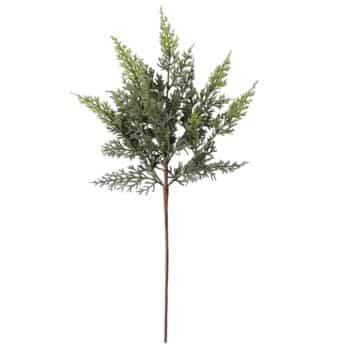 A single artificial green cedar branch with fine, feathery leaves and a brown stem, isolated on a white background.