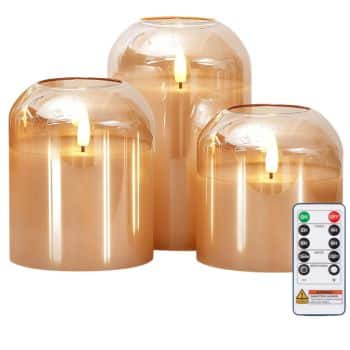 Set of three amber glass flameless candles with warm glowing flames and remote control.