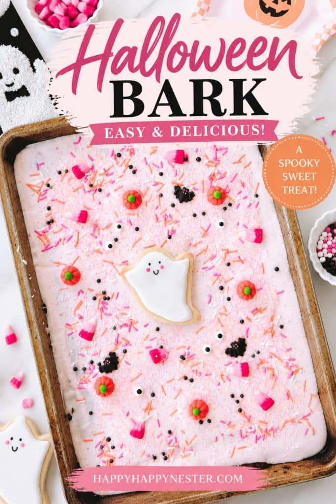 Easy Halloween bark recipe with pink chocolate, candy corn, pumpkins, bats, sprinkles, and ghost candy.