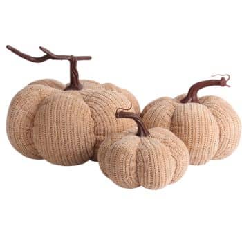 Set of three beige knit pumpkins in assorted sizes with rustic brown stems for neutral fall decor.