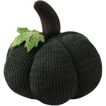 Black knit fabric pumpkin with a curved dark stem and green felt leaf for modern fall decorating.