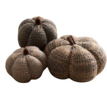Three brown and taupe cable knit pumpkins in assorted sizes with soft fabric stems for cozy fall decor.