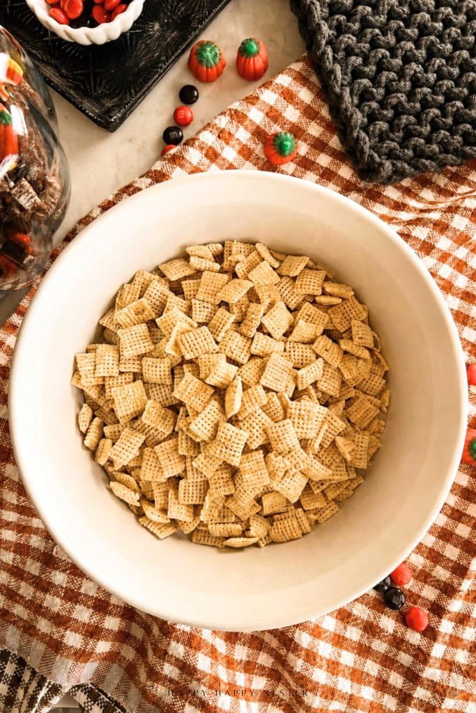 Measured Chex cereal in a bowl, ready to be mixed