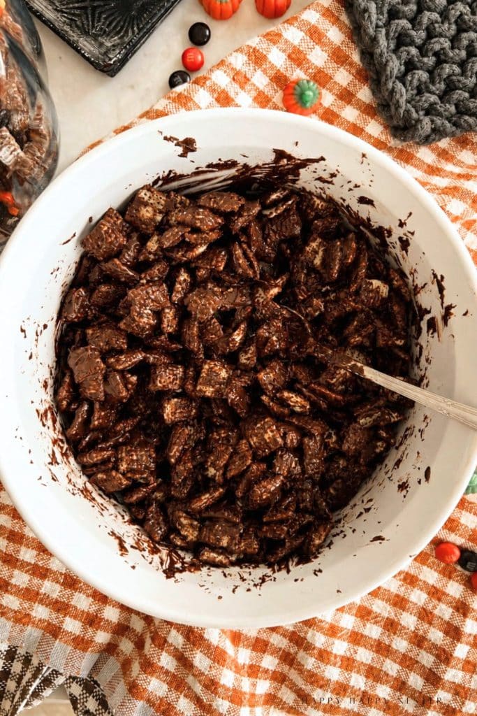 Chex cereal evenly coated in melted chocolate and peanut butter
