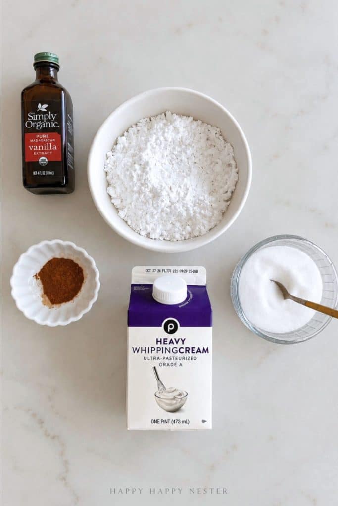 Cinnamon whipped cream topping ingredients with heavy whipping cream, powdered sugar, vanilla extract, cinnamon, and salt.