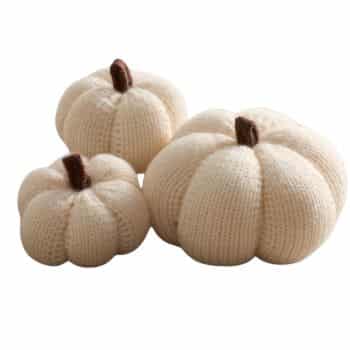 Set of cream knitted fabric pumpkins in assorted sizes with brown stems