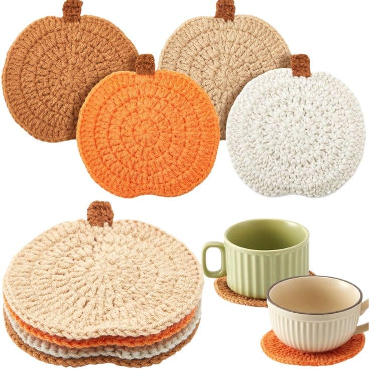 Crocheted pumpkin-shaped coasters in beige, orange, and white, displayed in a stack and with cups resting on them. The coasters have small brown stems and a textured pattern.