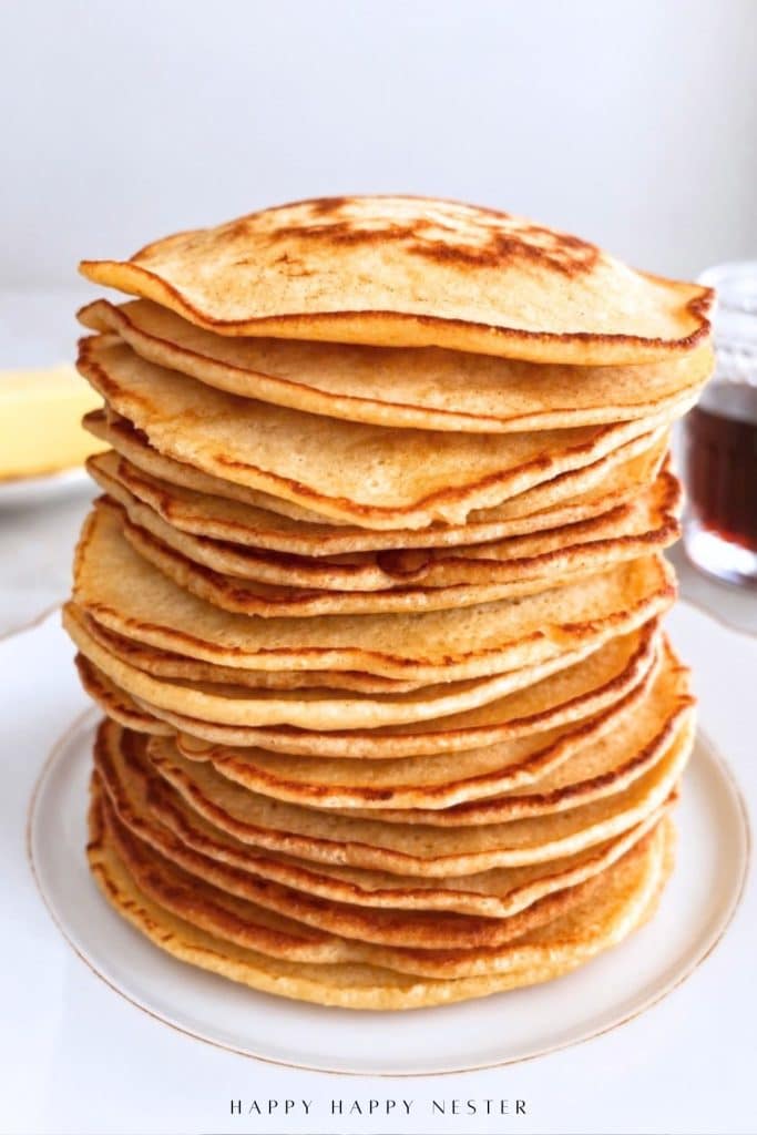 Close-up of a tall stack of thin flapjack-style homemade pancakes