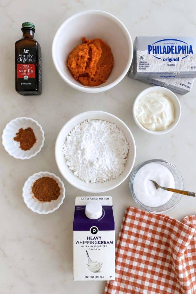 Pumpkin puree, cream cheese, sour cream, powdered sugar, heavy whipping cream, vanilla, cinnamon, and pumpkin pie spice for no bake pumpkin cheesecake.