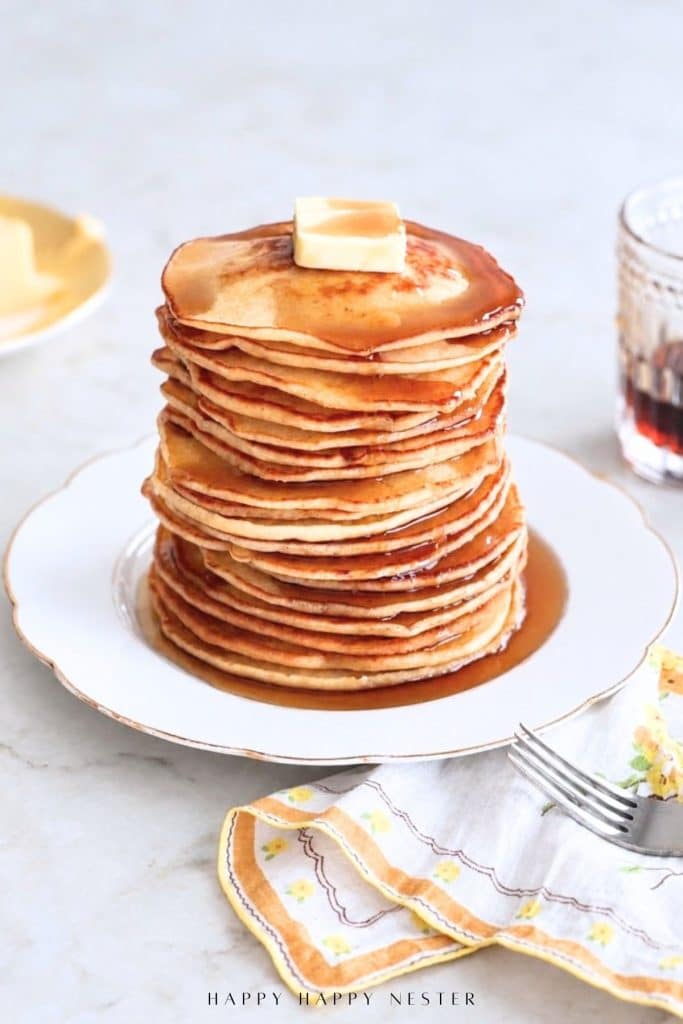 Pancakes from scratch stacked with butter and maple syrup