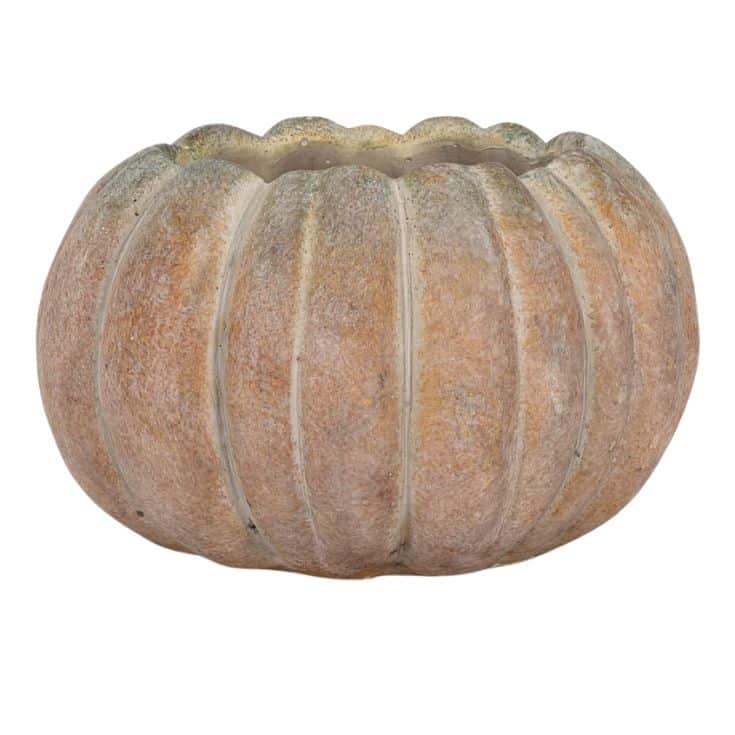 A round, pumpkin-shaped planter with a ribbed texture and a weathered, orange-brown finish, photographed against a white background.