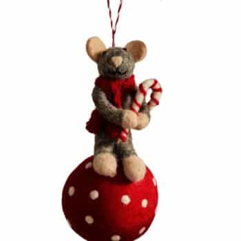 Felt mouse Christmas ornament holding a candy cane on a red polka dot ball.