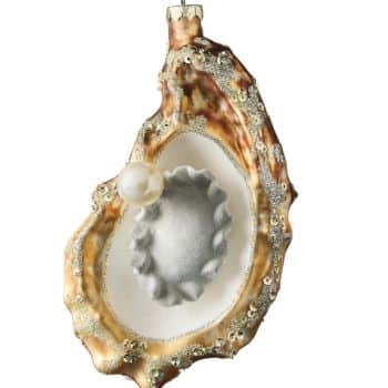 Oyster shell glass Christmas ornament decorated with glitter, sequins, and a pearl.