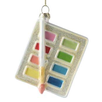 Artist paint palette glass Christmas ornament with colorful paints and brush.