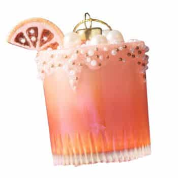 Pink cocktail glass Christmas ornament with pearl and citrus details.