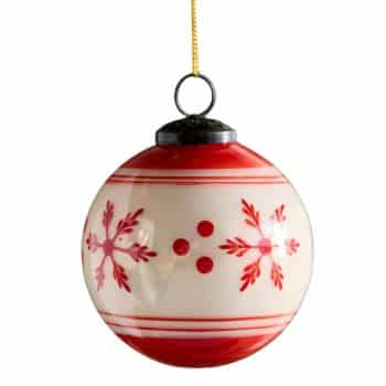 Red and white glass Christmas ball ornament painted with snowflakes.