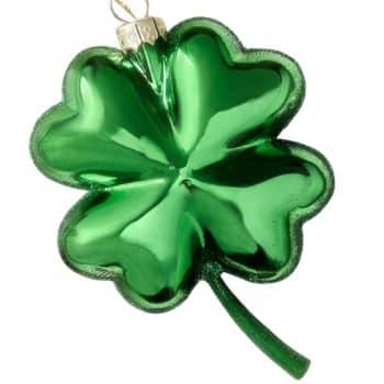 Green shamrock glass Christmas ornament with glittered edges.