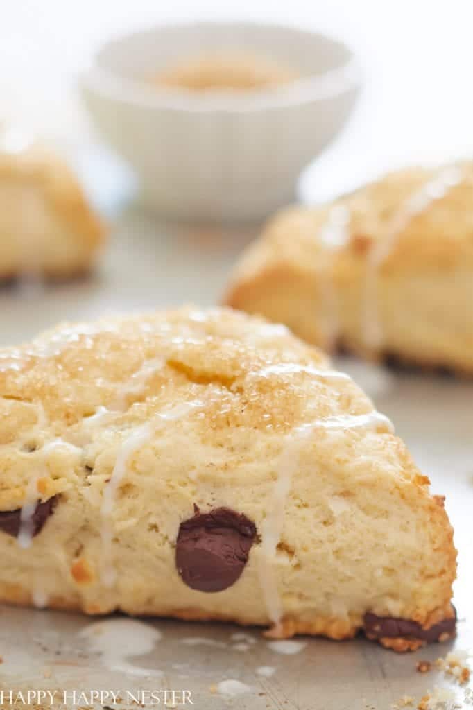 Chocolate chip scones drizzled with glaze and sprinkled with sugar, a perfect addition to holiday brunch ideas.