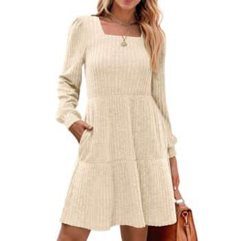 Cream ribbed knit dress with a square neckline, long sleeves, fitted waist, and front pockets.