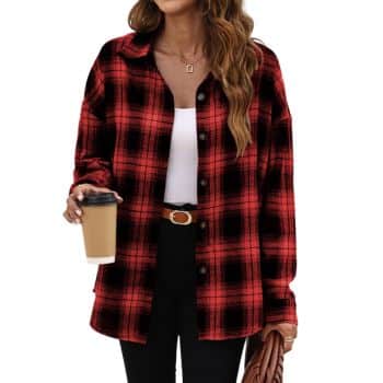 Red and black plaid long-sleeve button-down shirt worn open over a white top with black pants.