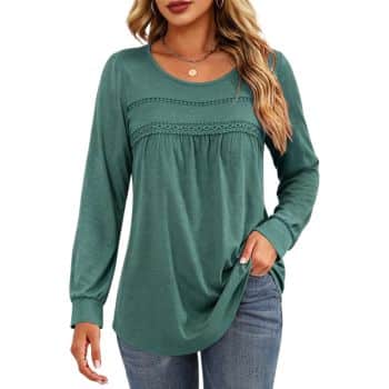 Teal green long-sleeve blouse with a round neckline, decorative lace trim across the chest, gathered fabric, and a relaxed fit.